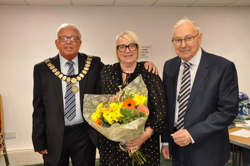 Chairman of Sedgefield Town Council, Councillor Mel Carr and Mayor of Sedgefield Peter Hinde presenting flowers to Mayor's Consort Jaime Hinde